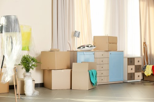 Satisfied customer and moving truck ready for relocation in Battersea